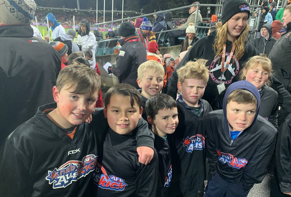 Bega Bombers Luke, Charlie, Harry, Hamish, Hayden, coach Amelie, Jack and Amber brace against the chill. (absent: Callum and Thomas)