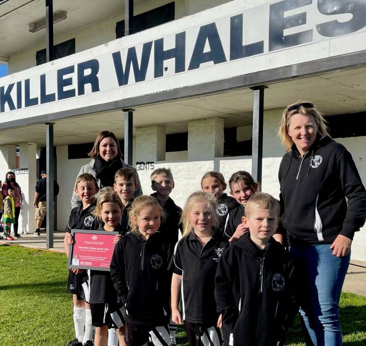 Eden-Monaro MP Kristy McBain with Eden Killer Whales club president Deb Heron and some of the junior talent of the club. 