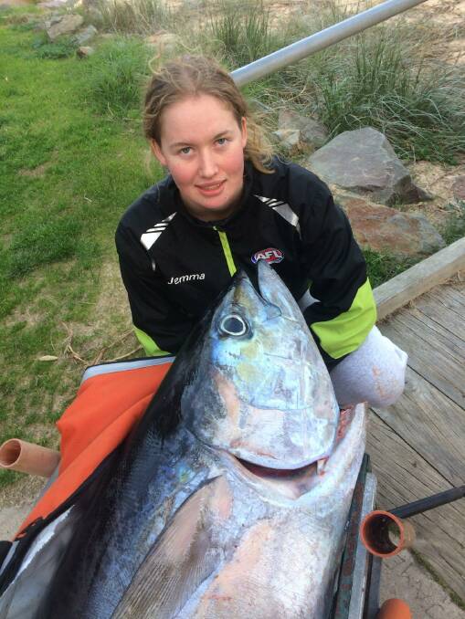 Great catch: Eden angler Jemma Pollock, 16, with her yellowfin estimated to weigh over 70kg before it was savaged by a shark. 