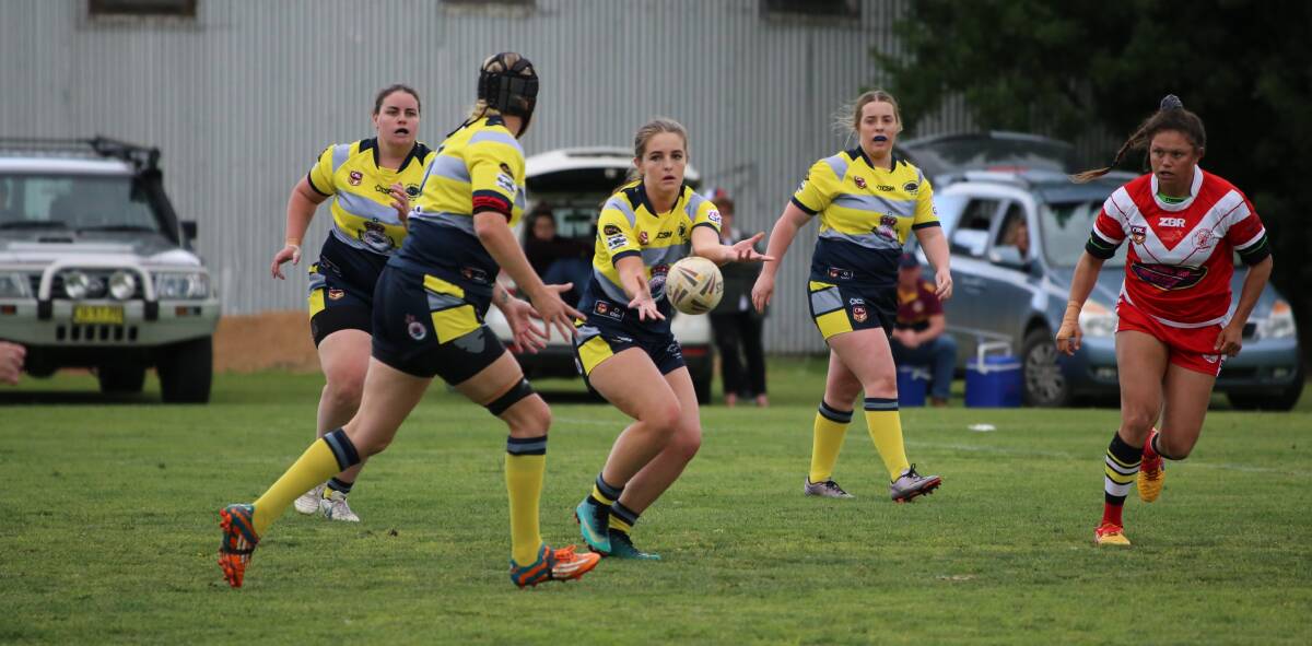 Kiarna Mitchell sends a pass to Leonie Balcomb during CBU's loss to the Narooma Devils on Saturday. 