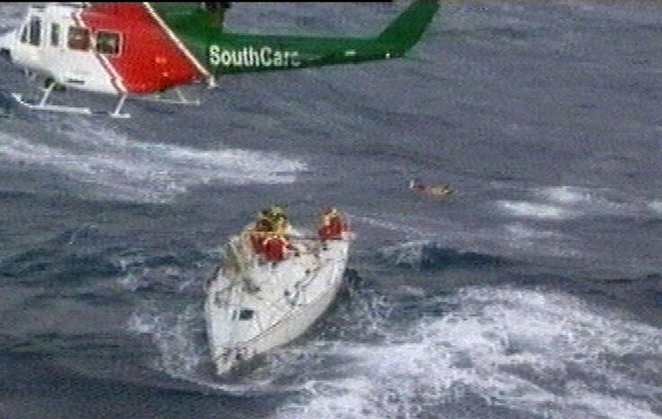 20 years on: Rescue choppers move in to airlift stranded sailors in the 1998 Sydney to Hobart. Picture: AP.