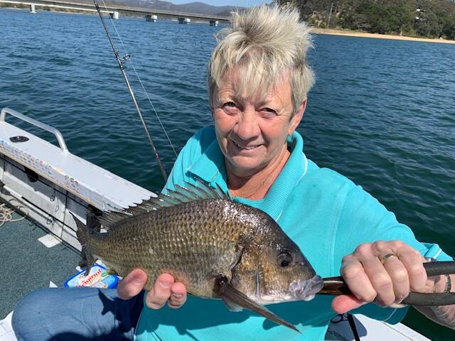Back you go: Helen Pearsall of Tura Beach shows a lovely catch-and-release bream at Mogareeka.