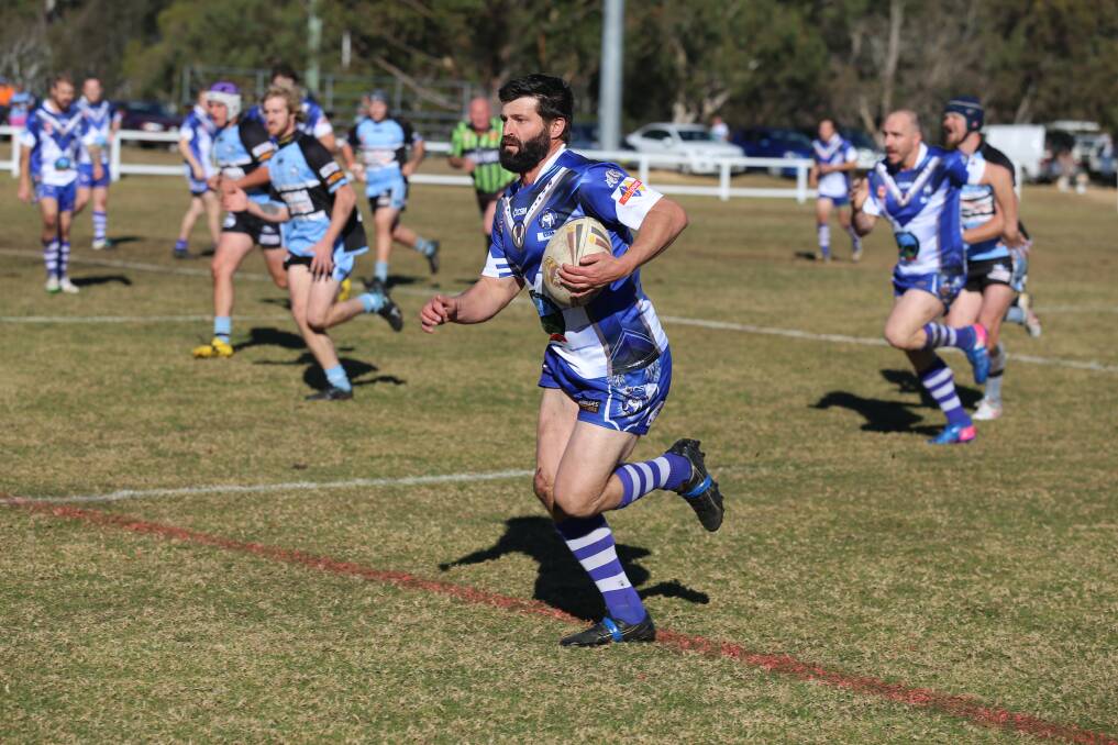 On the burst: Todd Bolton makes a line break to run 50 metres and score during a showdown with the Moruya Sharks on Saturday. 
