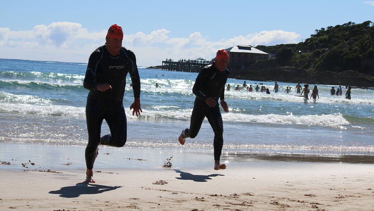 Mates make a dash for the finish line in the 2017 Wharf to Waves 