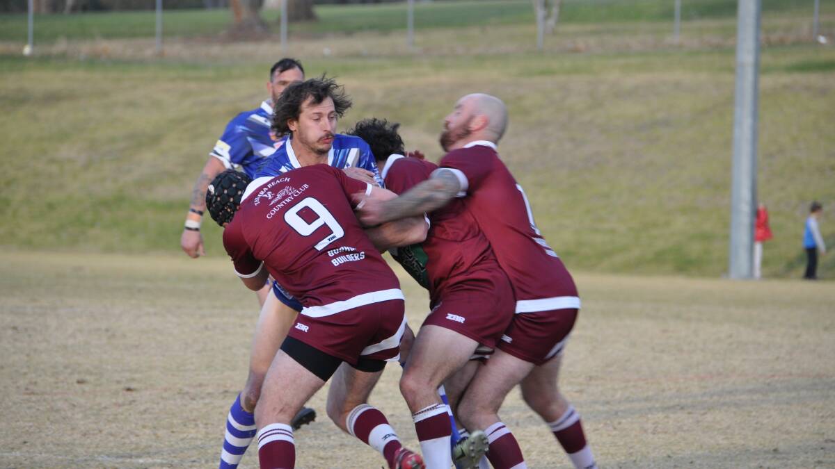 Hit up: A Merimbula-Pambula Bulldog gets wrapped up in the club's unfortunate loss in the elimination final against the Tathra Sea Eagles. Picture: Joel Erickson. 