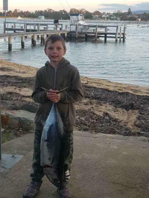 Nine-year-old Harley Walker holds his largest ever albacore, caught more than 60km off Tathra on the weekend.