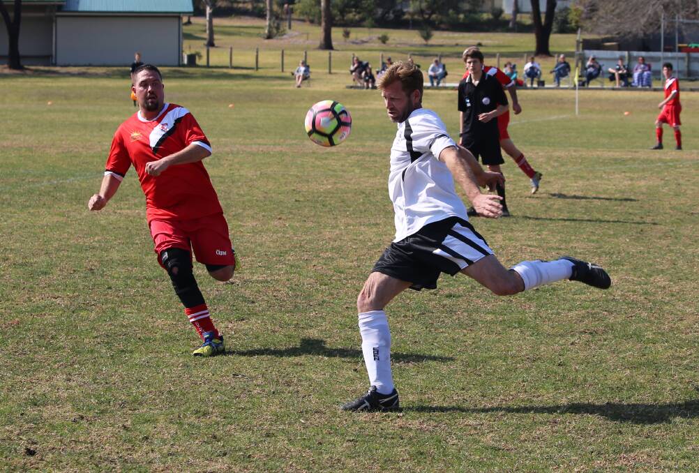 Send it: An Eden Killer Whale winds up for a big kick against Bega, with the club's social 7-a-side to start this month. 