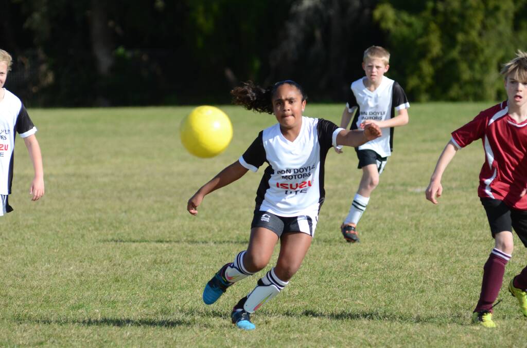On the ball: Nikeysha Landsborough looks to trap and control the ball during her first season of soccer with Eden's under 10s last year. 