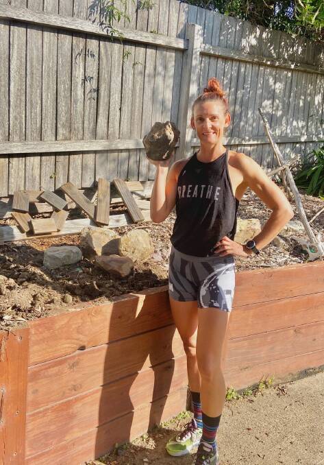 Wolumla's Katrina Oldham shows off one of the rocks she's been stock piling during isolation for a garden makeover. 
