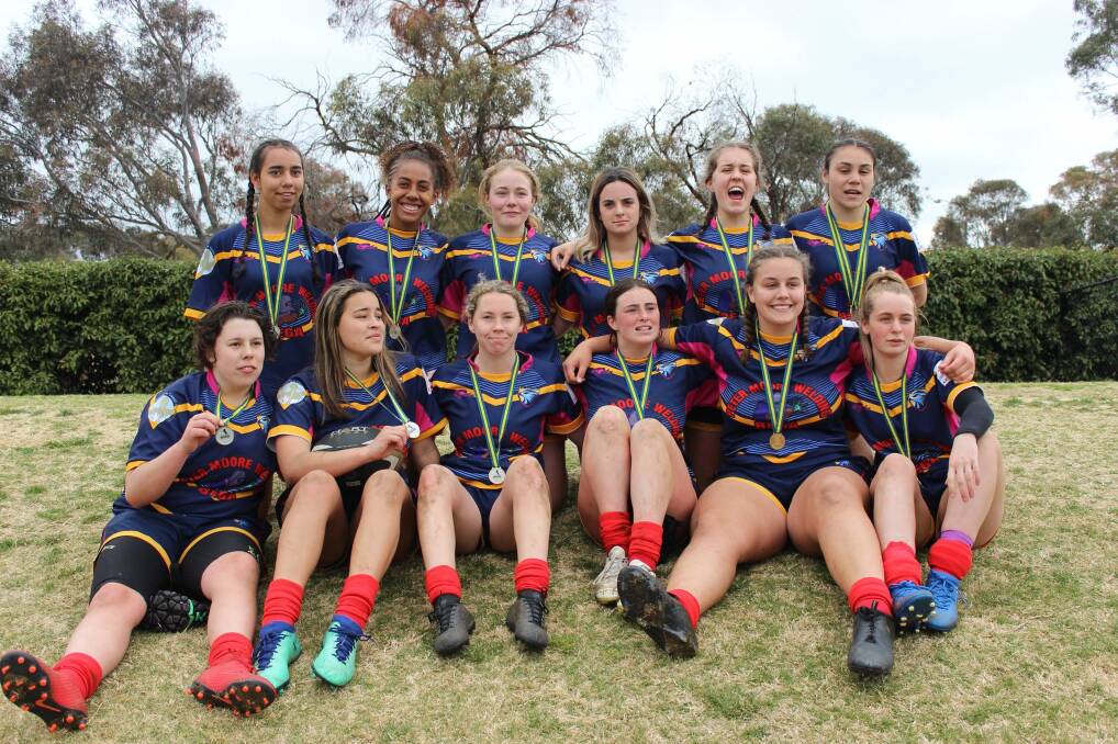 Champions: The under 16s Red Falcons with their premiership medallions after winning the grand final last weekend. Picture: Leonie Doyle. 