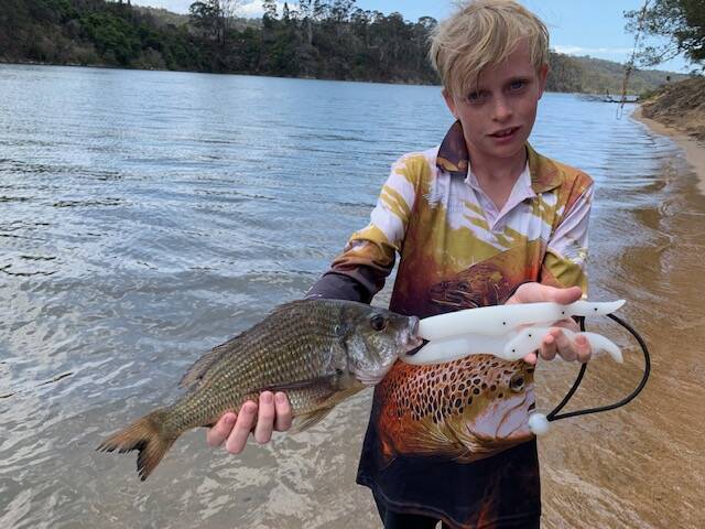 Happy visitor: Twelve-year-old Hamish O'Brien, from Wellington, NSW, shows off a lovely bream he caught in the Bega River. 