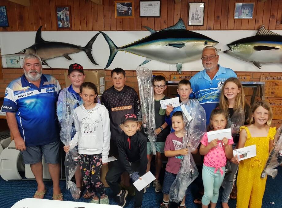Tri-Estuary Challenge winners: Ron Vanderdrift of Tackle World and Club President Peter Haar with a group of excited club juniors.