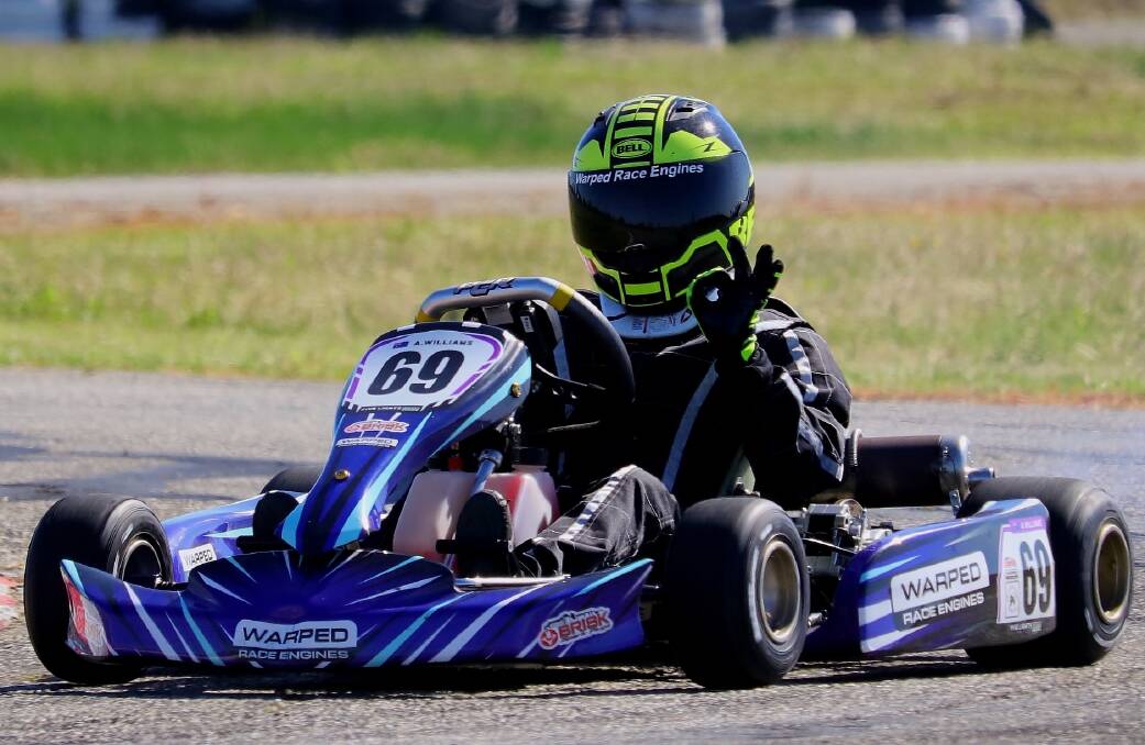 Out in front: Moruya kart racer Aidan Williams signals a successful run after racing to a win in the Southern Stars opening round at Wagga Wagga. Picture: five lights photography 