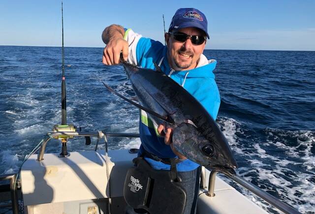 Great day out: Club member Harley Jenkins of Berrambool holds his first ever caught albacore (longfin tuna).