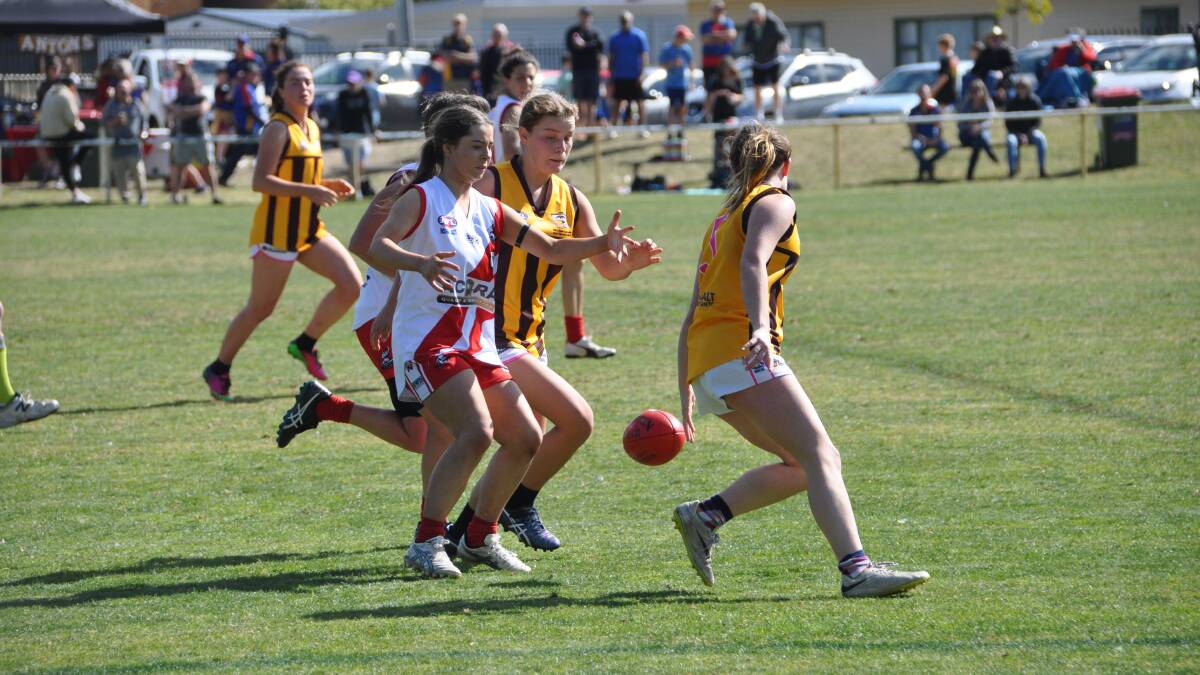 An Eden Whaler, pictured in a ball contest against Pambula last year, with the Whalers suffering losses in women's and seniors on the weekend. 