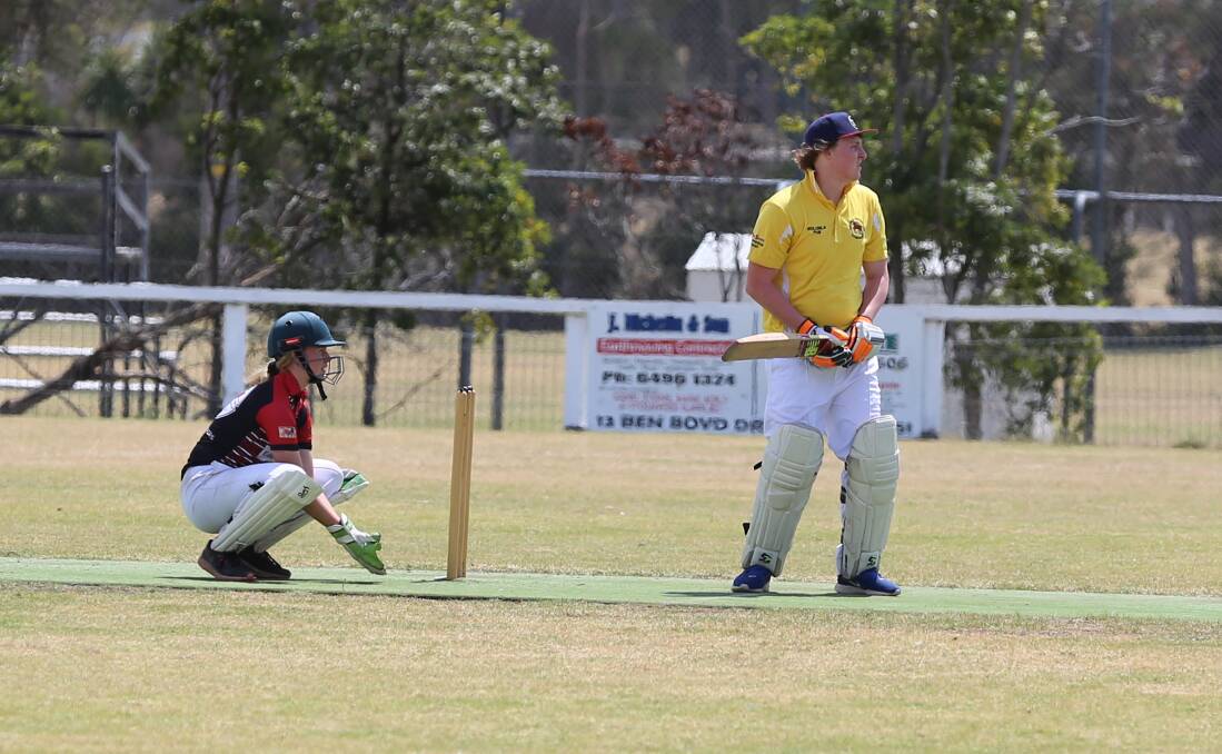 Jemma Pollock guards the stumps at keeper with Wolumla's Aiden Bailey lines up for a bat at the Eden Cricket Ground on Saturday. 