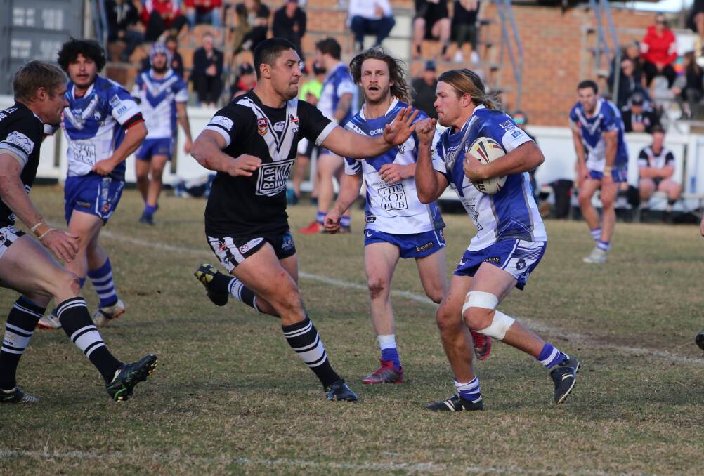 Hard runner: Daniel Cronk charges headlong into the Cooma Stallions during Sunday's clash locking in a Bulldogs home elimination final. 