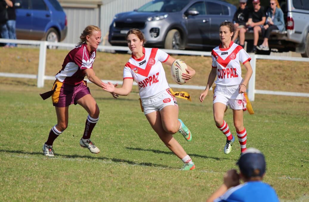 Edge run: Rebecca Gray, one of the try-scorers against Tathra, makes a burst down the sideline during Sunday's 74-0 dominance. 