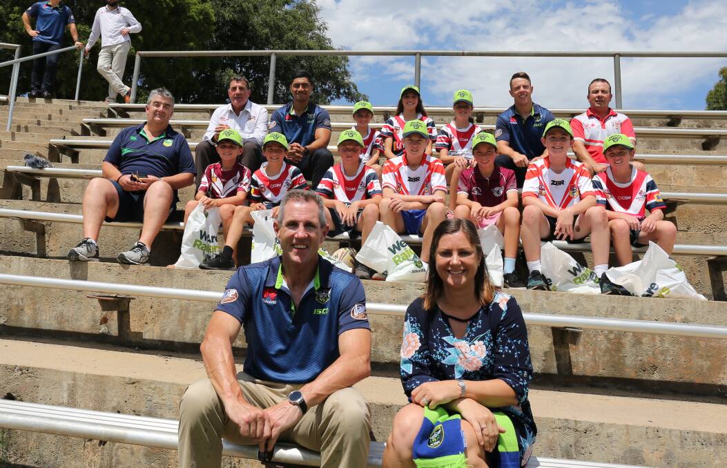 Canberra Raiders CEO Don Furner and Bega Valley mayor Kristy McBain (front) with Canberra players and Group 16 officials to announce the February trial game. 