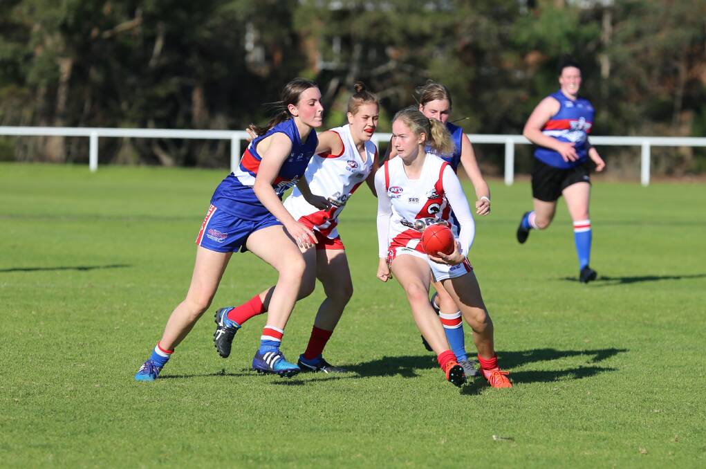 Goal scorer: Jemma Pollock gets the ball away cleanly from her Merimbula opponents during the Whalers' strong win at Berrambool on Saturday. 