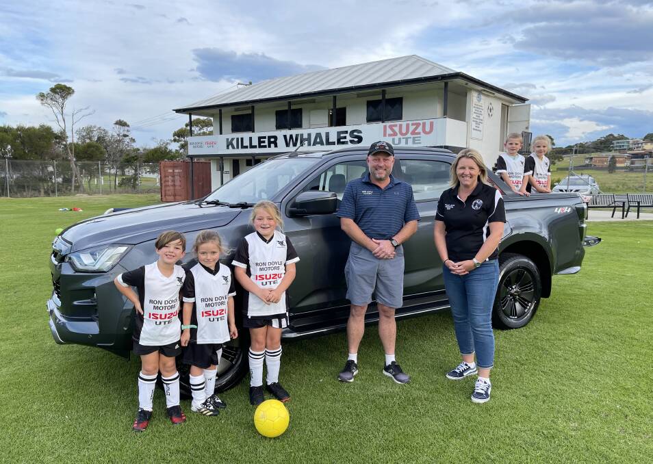 Ongoing support: Troy Altmann of Ron Doyle Motors and Isuzu Ute catches up with Killer Whales president Deb Heron and some eager junior players recently ahead of the 2021 season. Picture: Killer Whales. 