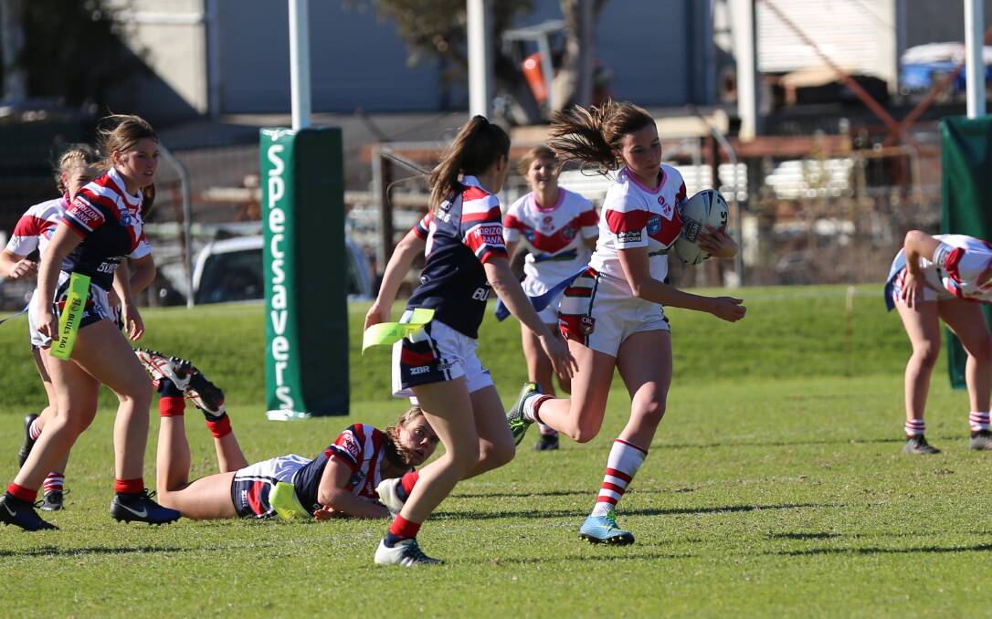 Georgia Caldwell makes a break from the Roosters during the Tigers' 18-8 win on Saturday with the club to face Narooma in a table topping clash this weekend. 