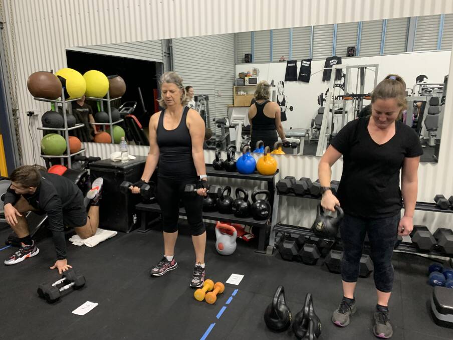 Bermagui Fitness Factory members work through their regular routines while maintaining social distancing recently. 