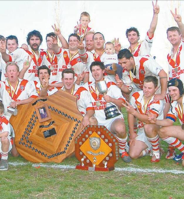 Tigers glory: Players from the 2008 premiership winning side celebrate with the Group 16 shield, with the club hosting a reunion on the June long weekend. 