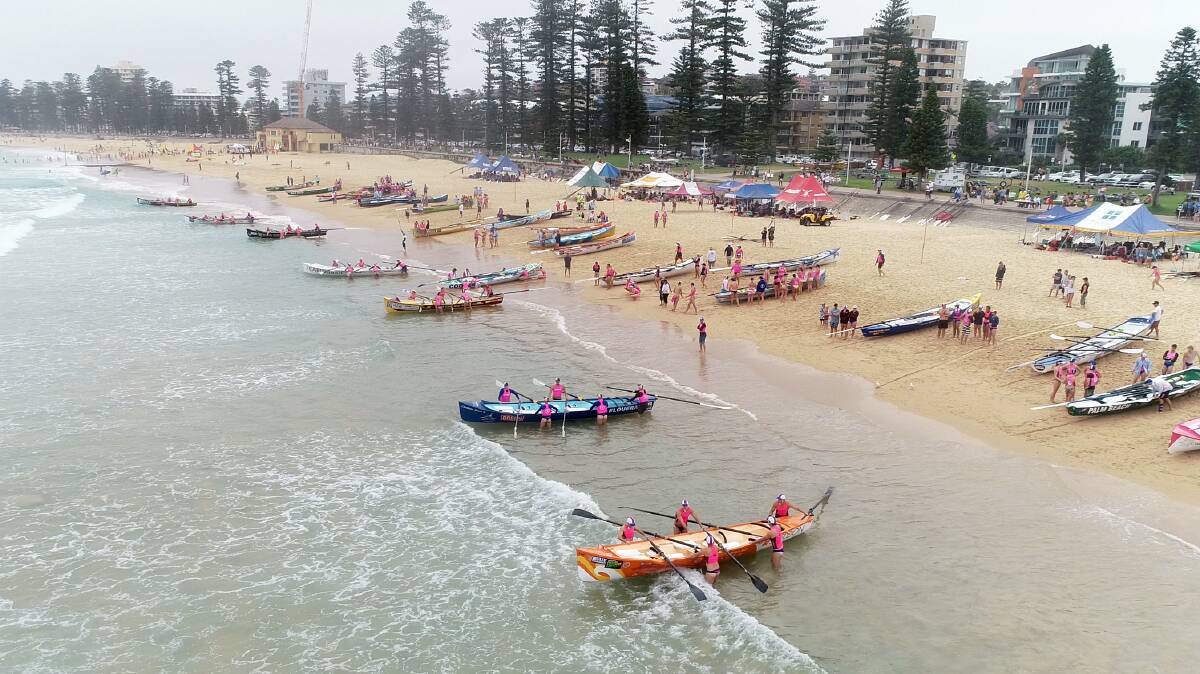 Heading out: Surf boat crews set up for one of the races during the Interbranch Surf Boat Championships at Queenscliff last week. Picture: SLS NSW. 