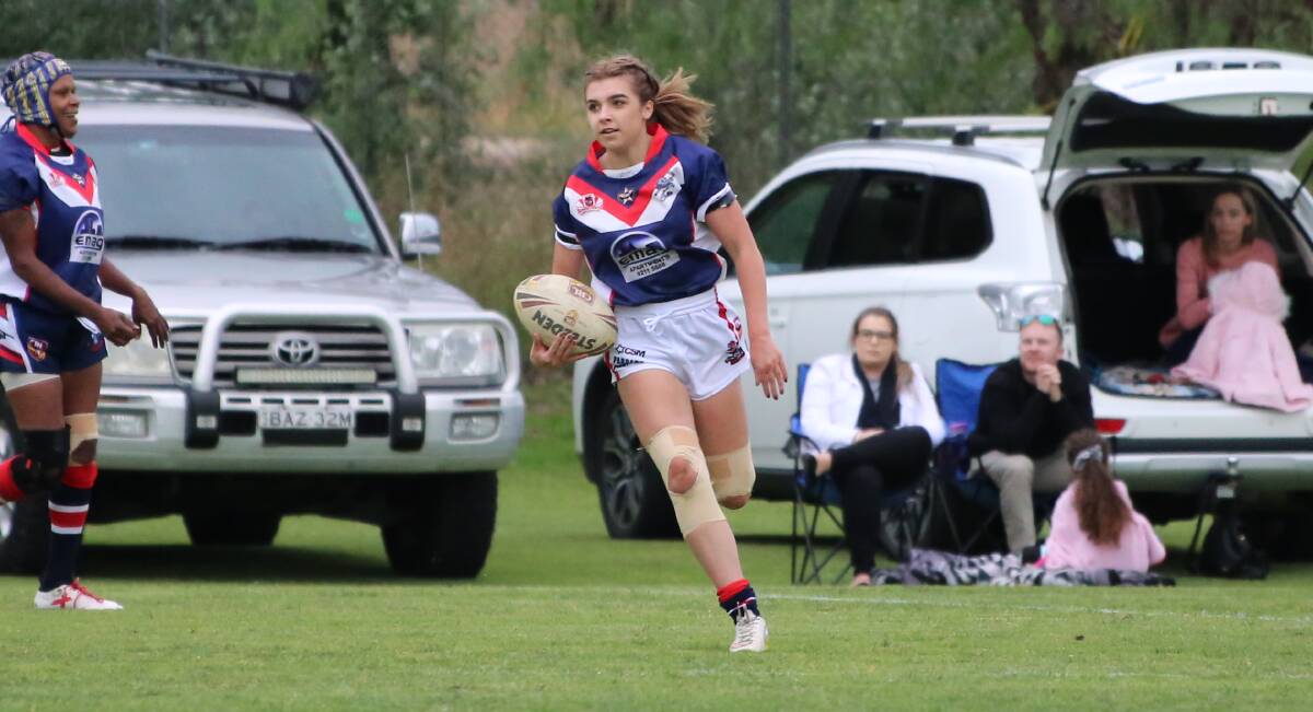 Alex Spivey makes a run for the Bega Roosters in their 12-4 win over the Tathra Sea Eagles on Saturday. 