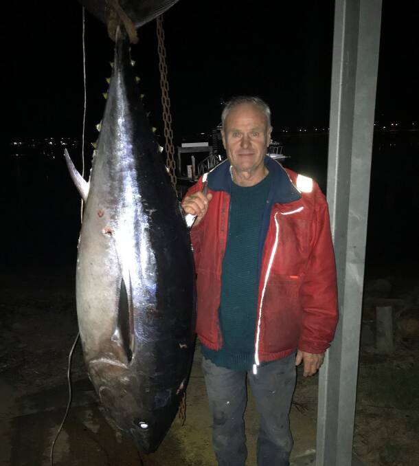 What a beauty!: Ross Cooper of Wolumla with a magnificent 100.5kg southern bluefin tuna taken last Sunday off Merimbula.