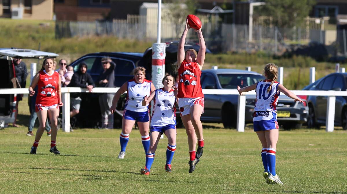 A Whaler neatly gets under a mark in their contest with Merimbula with the women's squad hammering home a win over Bega on Saturday. 