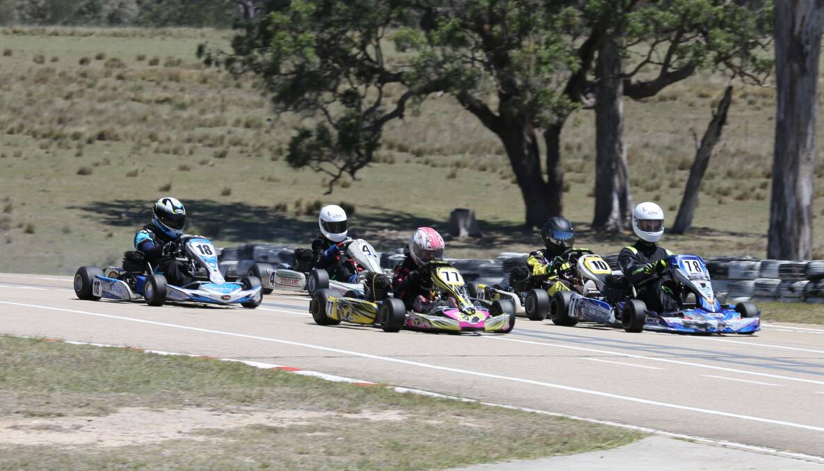 Juniors were tightly clustered during one of their afternoon heats on Saturday at the Sapphire Coast Kart Club. 