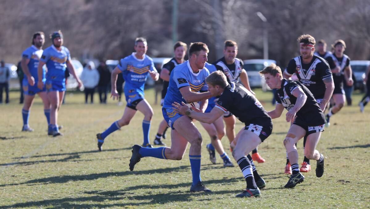 Beast: Bombala's Luke Ingram - pictured crashing into the Cooma Stallions - is one of three Group 16 players vying for a spot in the country championship grand final. 