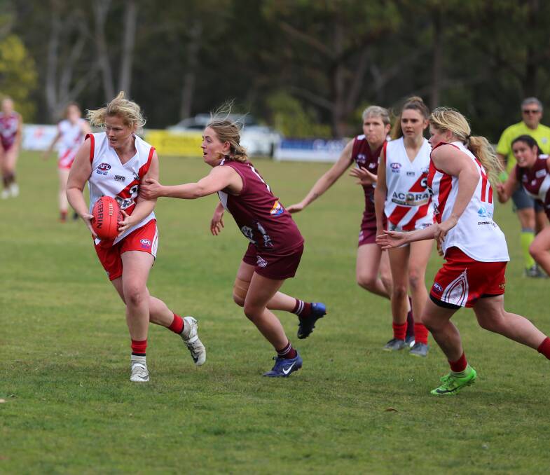 Whalers Kate and Mel MItchell pair up through the middle to keep the ball out of Tathra's possession during their hard-fought win on Saturday. 