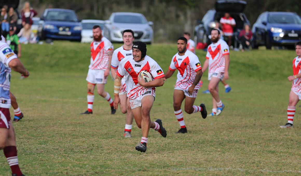 Elvis Tui runs a hard hit-up against Tathra on Sunday with both clubs wearing specially designed Koori jumpers. 