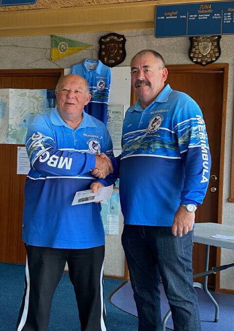 MBGLAC vice-president Alan Wilkins presents club secretary Chris Young with his prize for top place in the bream category.