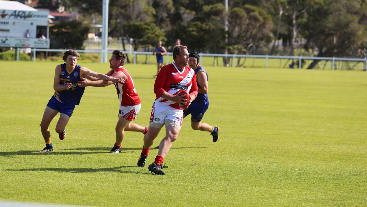 Whaler Bradley Wills looks for an option during Eden's reserve grade win over Bermagui on Saturday. 
