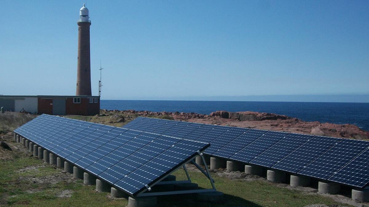The newly-installed solar panels in front of the historic lighthouse. Photo: Supplied.