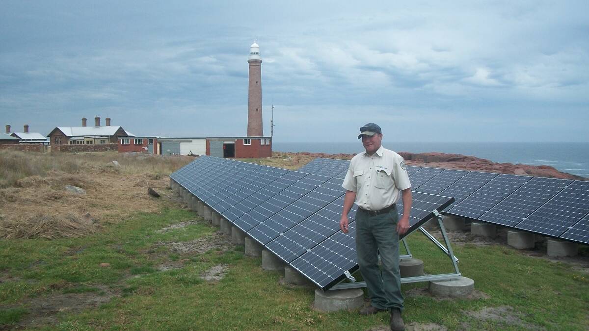 Mallacoota team leader Phil Reichelt in front of the solar panels. Photo: Supplied.