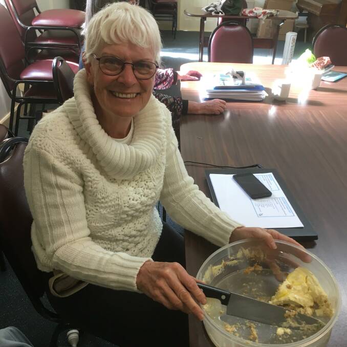 CWA G&T: Lynn Lawson secretary of CWA Cobargo branch, pictured with the last piece of her delicious gin and tonic cheesecake at the last meeting of the conference committee.