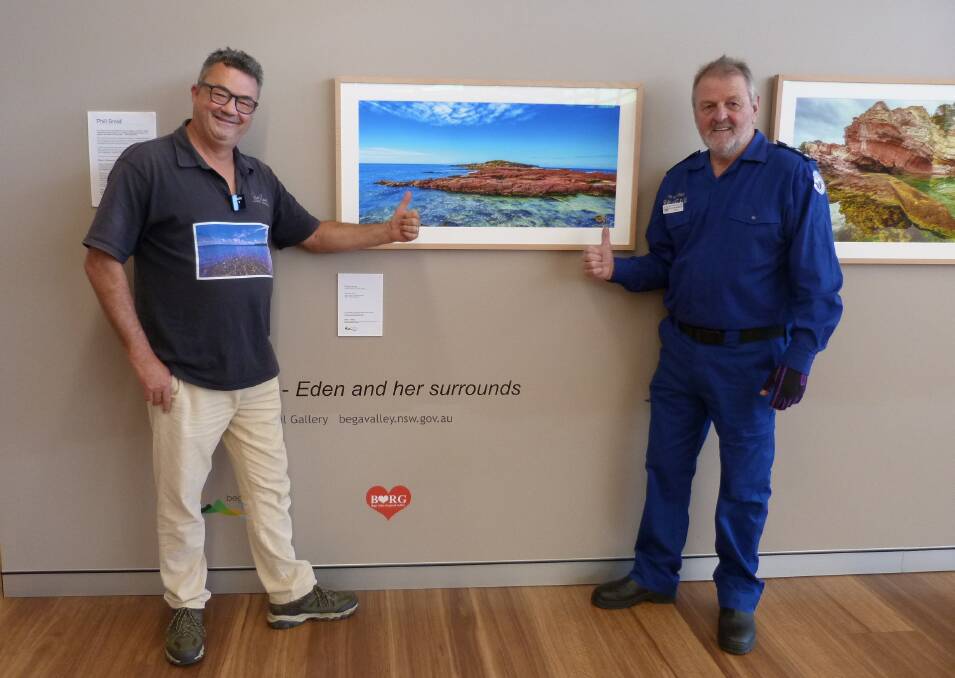 Eden-based photographer Phill Small and Marine Rescue Eden's unit commander Stuart Manson at the Bega Valley Regional Gallery's pop up exhibition space, TARMAC, at Merimbula Airport. Photo: Leah Szanto