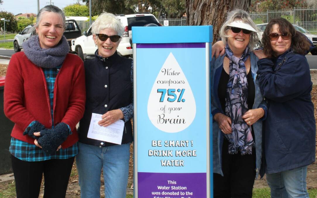 Tatiana Pajo, Cherie Mercado, Joy Robin and Fiona Campbell standing beside the water station purchased with funds donated by the Eden Lionesses. Photo supplied.