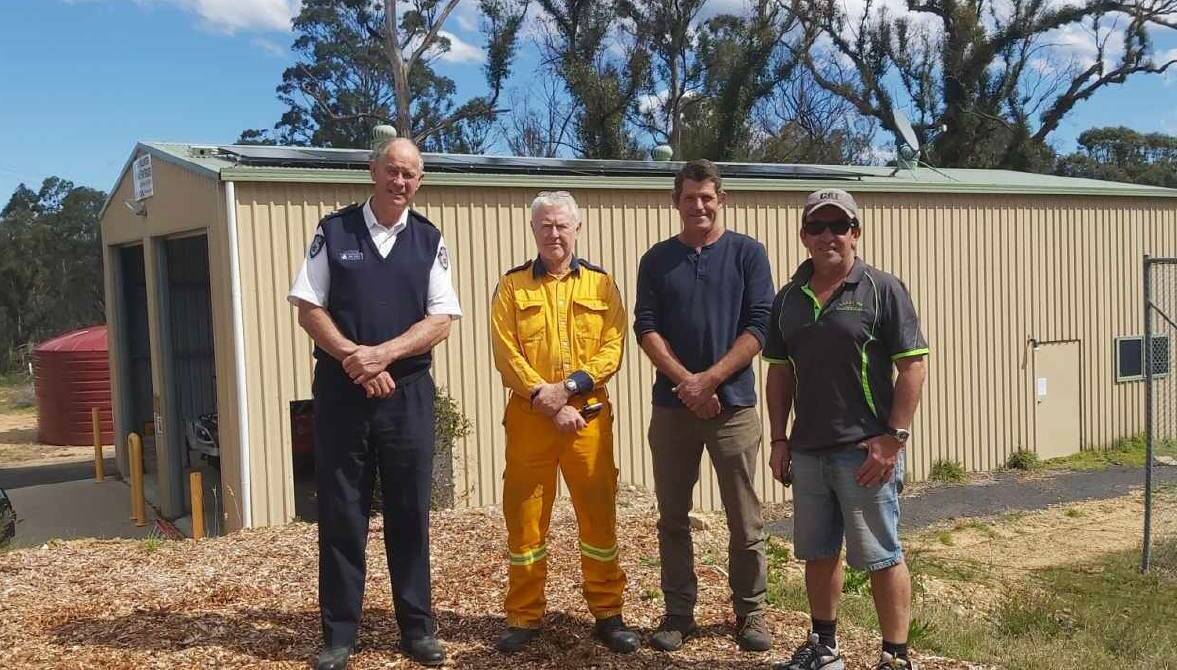 Celebrating the installation of solar panels on Kiah's fire shed in September of 2020 are RFS Superintendent John Cullen, the fire brigade's Jeff Browning, CEFE's Derek Povel and Lakeside Electrical's Paul Palacios. Photo: supplied