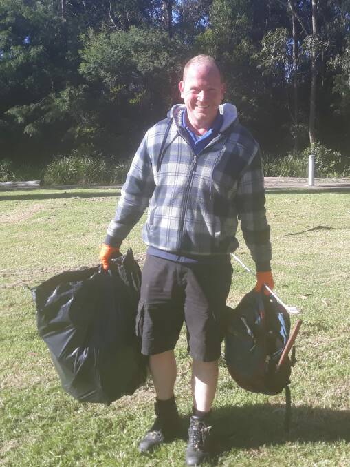 Jason Houston braved the cold morning along with up to 60 others to pitch in and clean up around Lake Curalo on Saturday, May 29. Photo: Amanda Midlam
