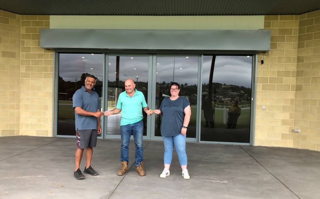 Council's project manager Andrew Foster (centre) handed over the keys to the new Barclay Street Pavilion in Eden to Drew Mudaliar from the Eden Cricket Club (left) and Nicole Crowe from the Eden Whalers AFL Club (right) on Wednesday 22 December 2021. Photo supplied.