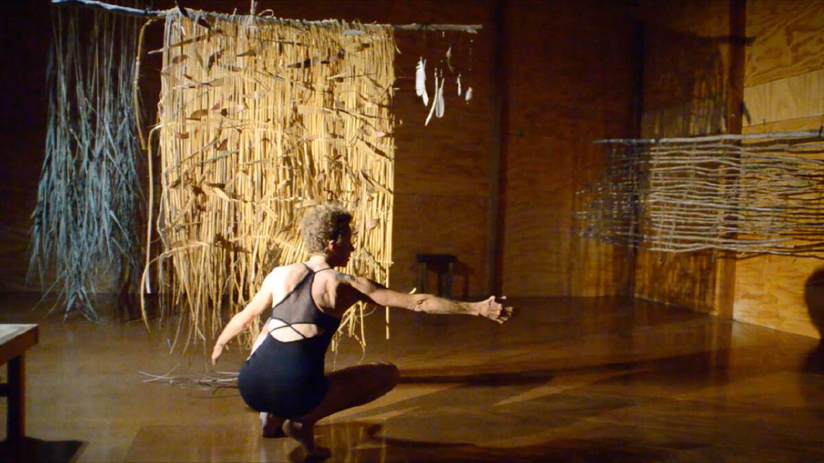 Jane Mortiss performing her work Divergence at the studio in Kiah before the Black Summer fires destroyed it. Photo supplied.