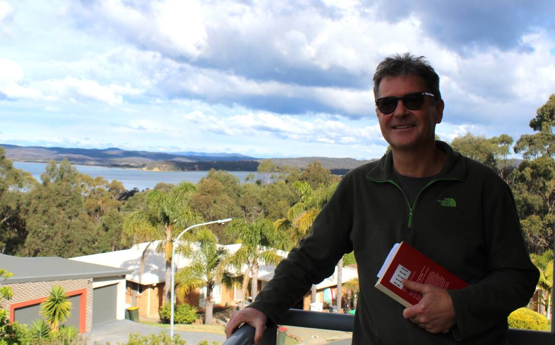 Acclaimed author John Hughes and his wife retired to Eden in 2020. Photo: Leah Szanto