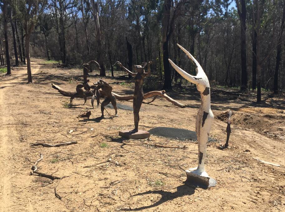 The driveway is lined with sculptures by Jesse Graham, whose entire family are artists. Photo: Leah Szanto