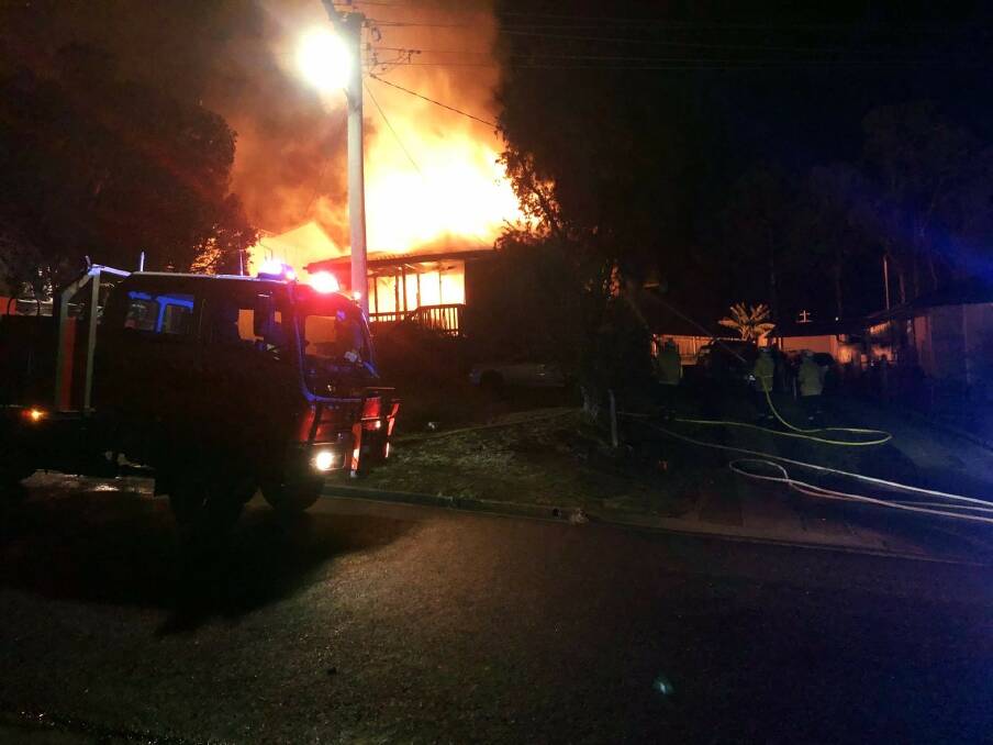 The house on Bank St, Eden on fire on Tuesday night. Picture: Fire and Rescue NSW Station 286 Eden